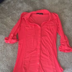 Red/orange button up shirt.